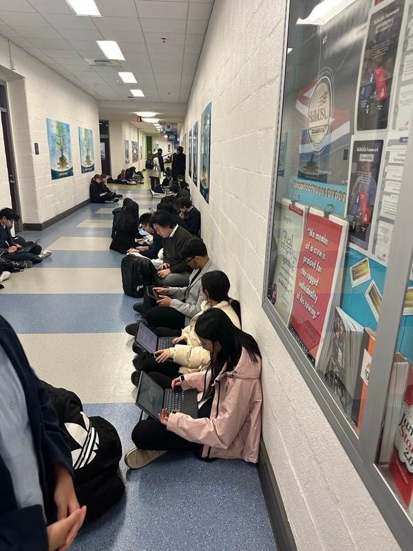 Student debaters preparing a case against the clock