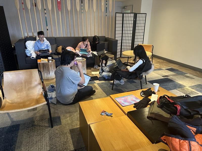 A debate team preparing cases together before rounds